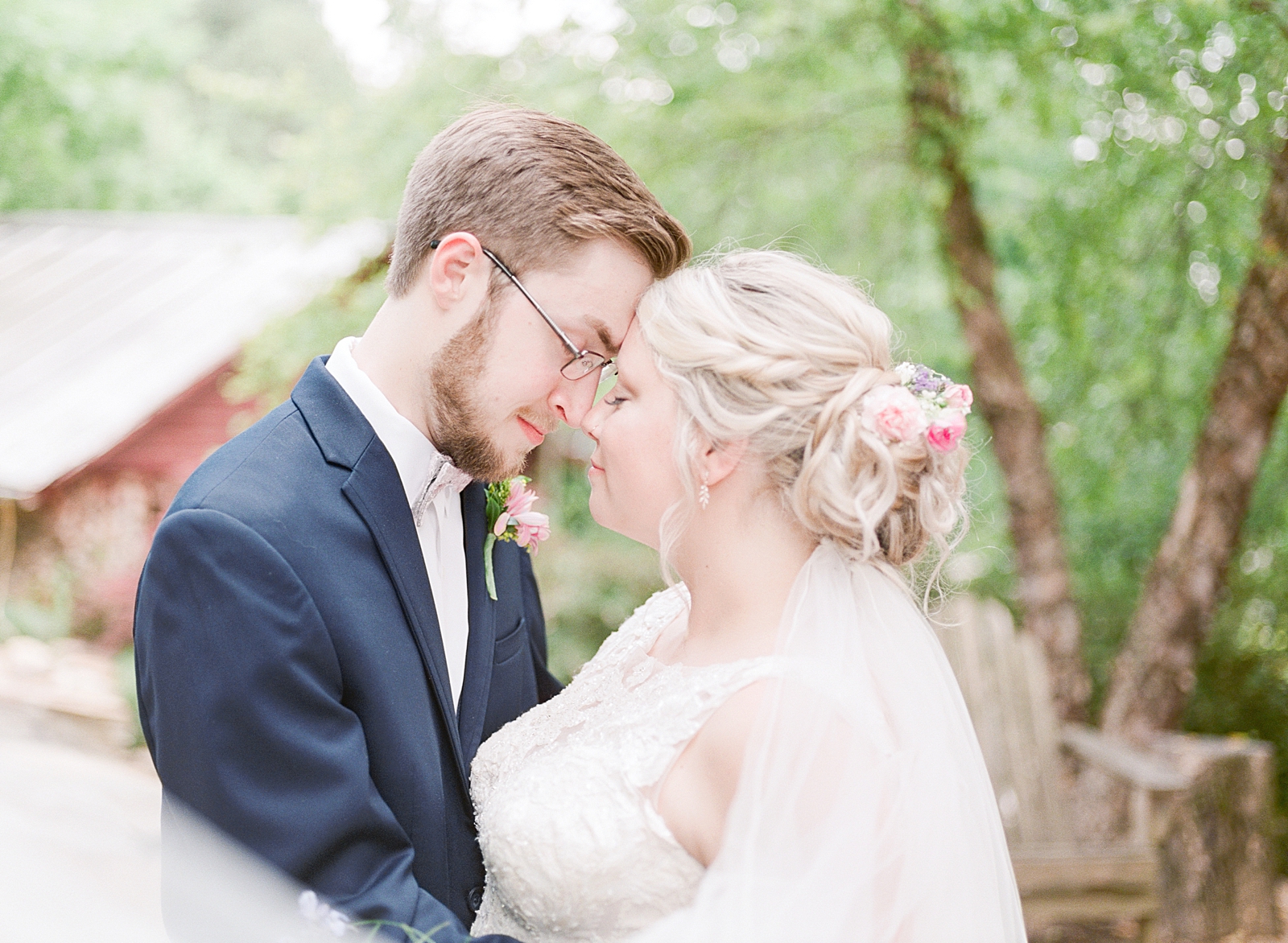 Black Fox Farms Garden Wedding Bride and Groom Snuggling Nose to Nose Photo