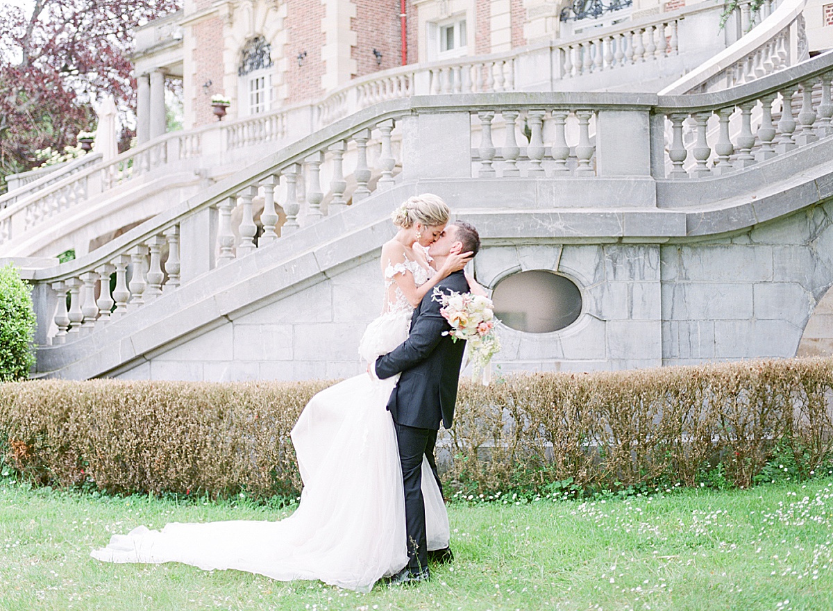 Château Bouffémont Wedding Groom Holding Bride Kissing Photo
