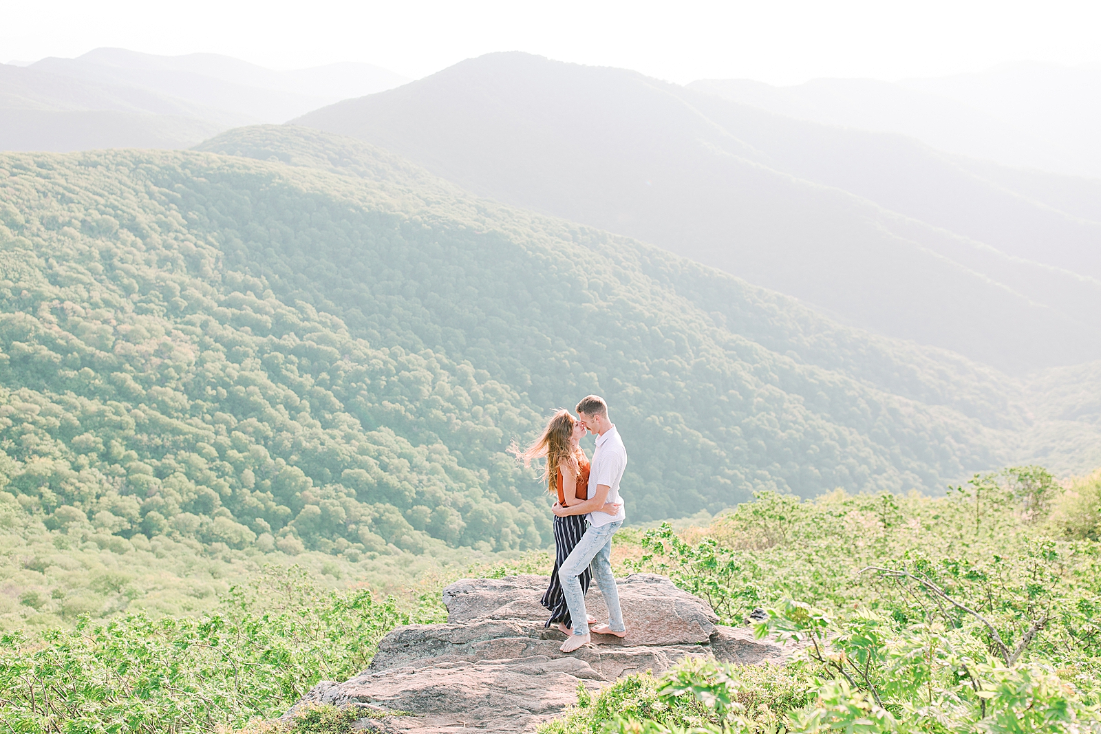 Craggy Gardens Engagement Couple Out on Rock Overlooking Mountains Photo