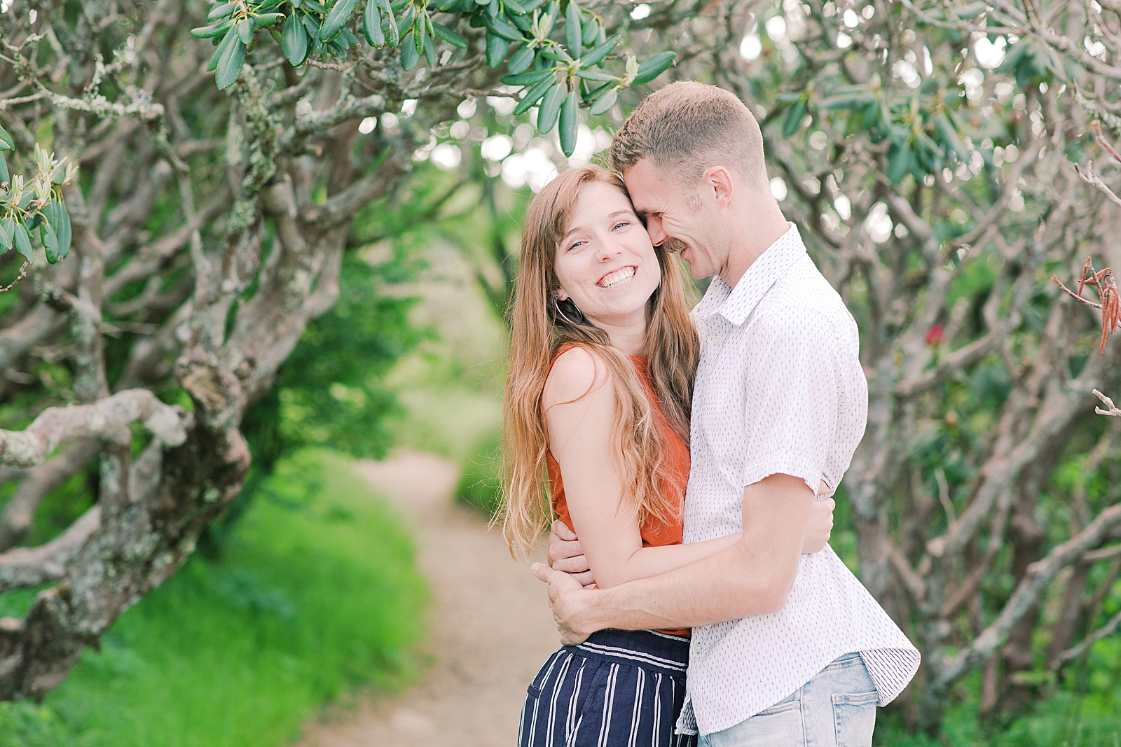 Craggy Gardens Engagement Couple hugging Megan Laughing at Camera Photo