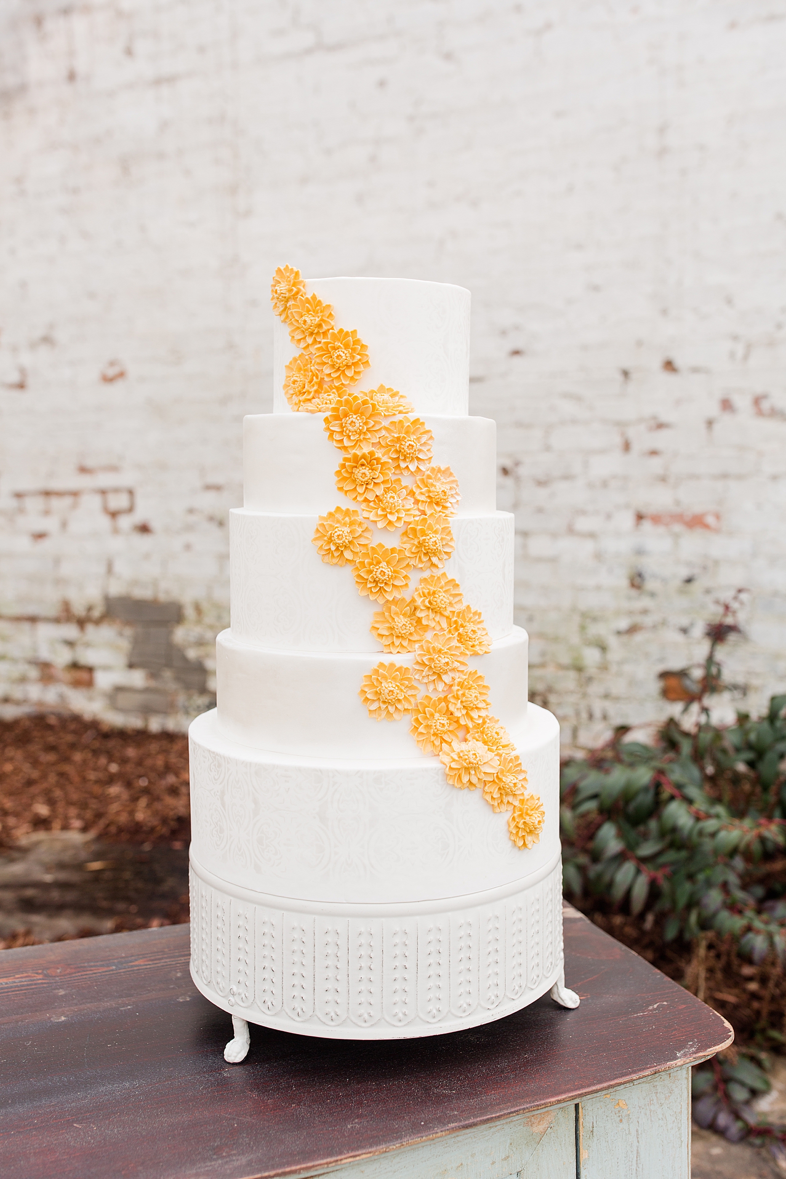 Hackney Warehouse Wedding five tier Cake with Yellow Flowers Photo