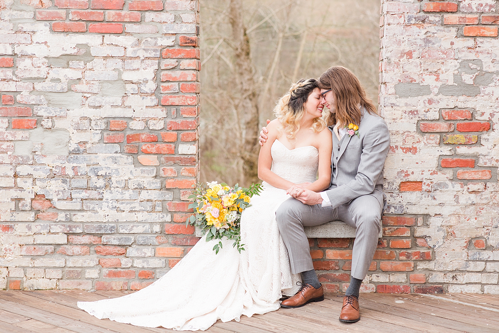 Hackney Warehouse Wedding Bride and Groom Sitting in Window Nose to Nose Photo