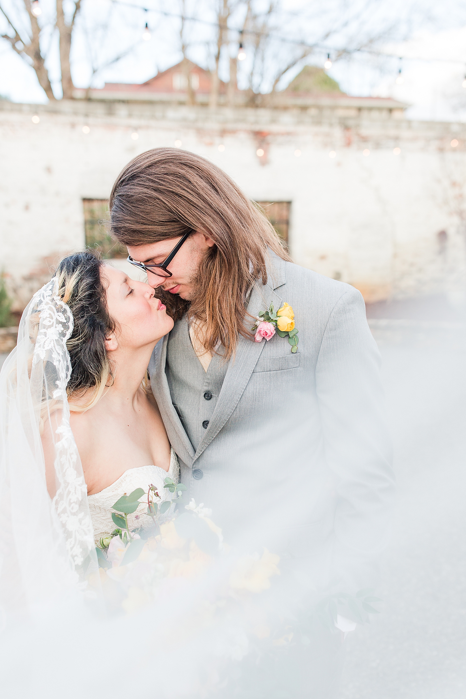 Hackney Warehouse Wedding Bride and Groom nose to nose with veil sweeping in front Photo