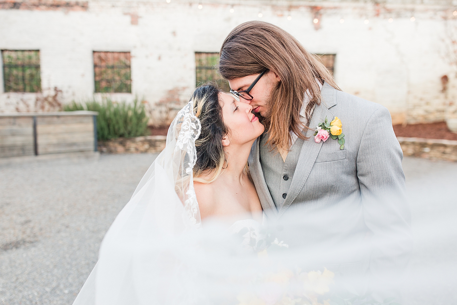 Hackney Warehouse Wedding Bride and Groom nose to nose with veil sweeping in front Photo