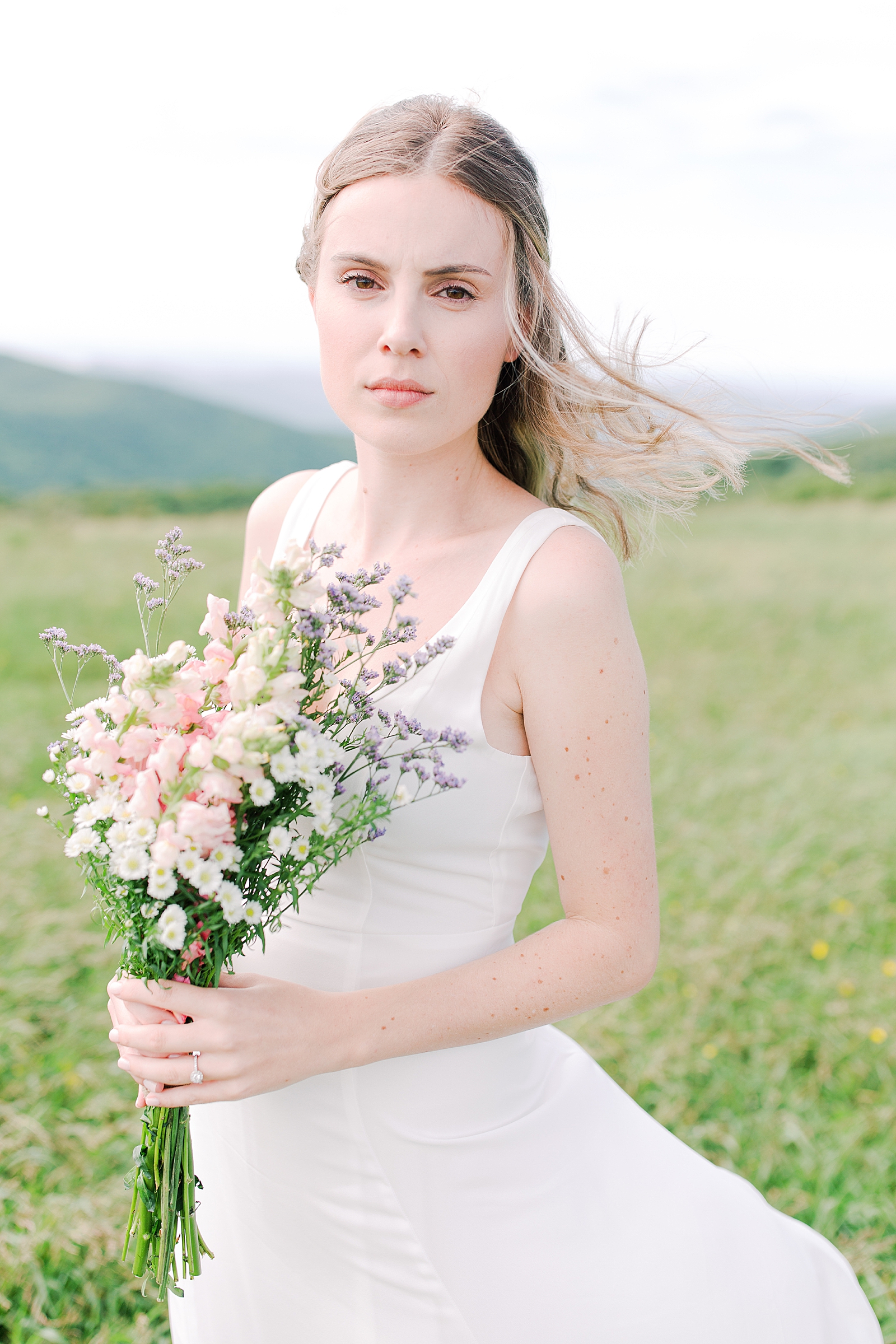Max Patch Elopement Bride Looking at Camera with Wind Blowing In Her Hair Photo