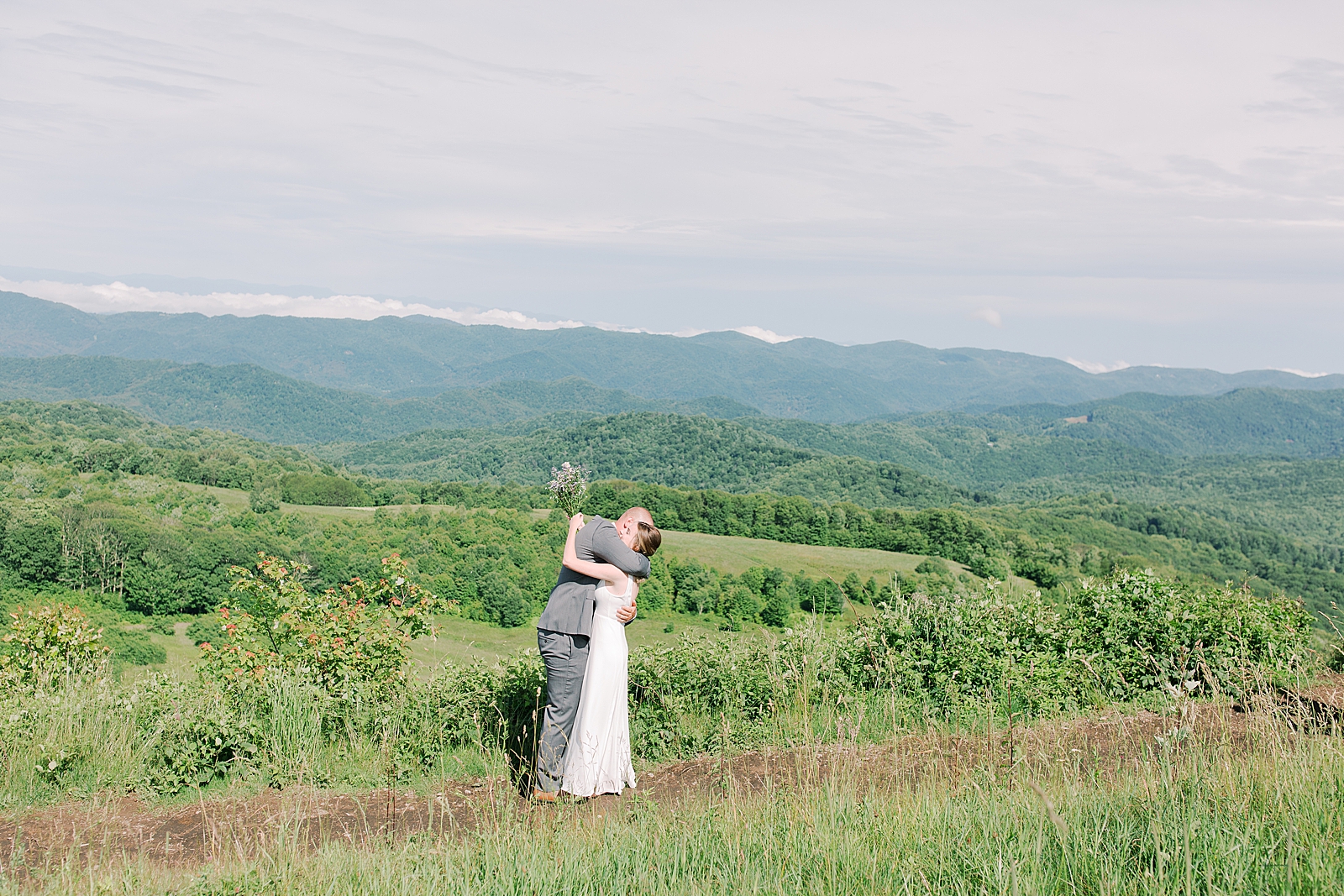Max Patch Elopement Bride and Groom First Look Hugging Photo