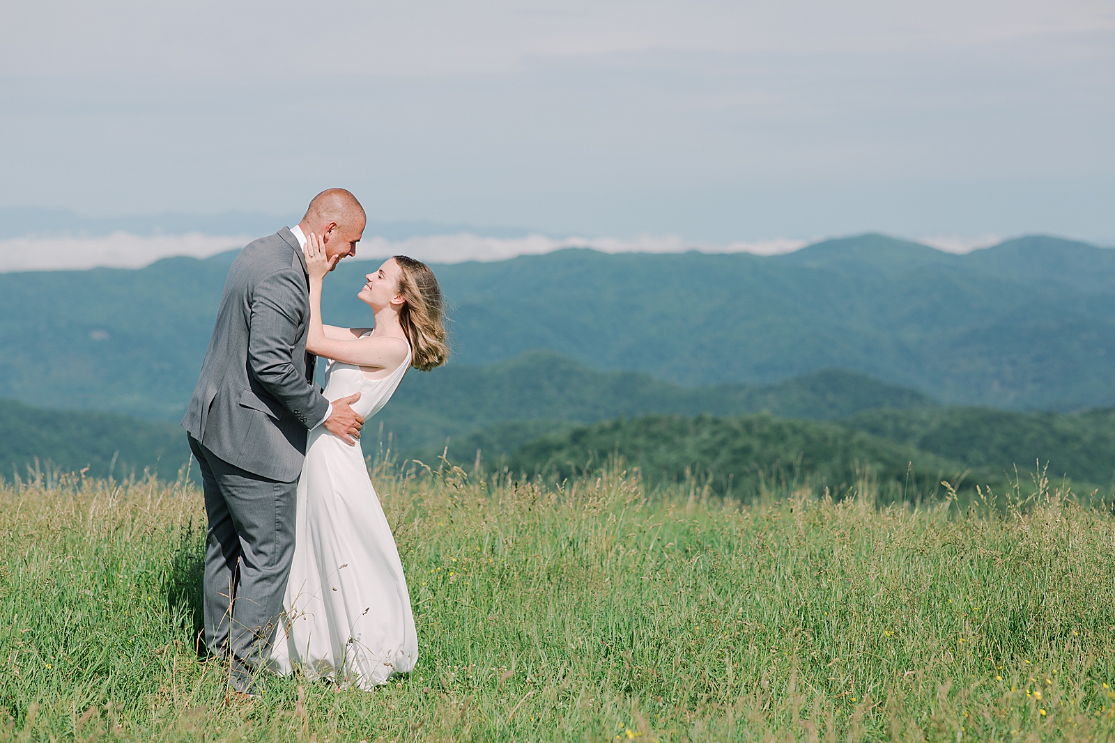 Max Patch Elopement Bride and Groom Looking At Each Other with Mountains in The Background Photo