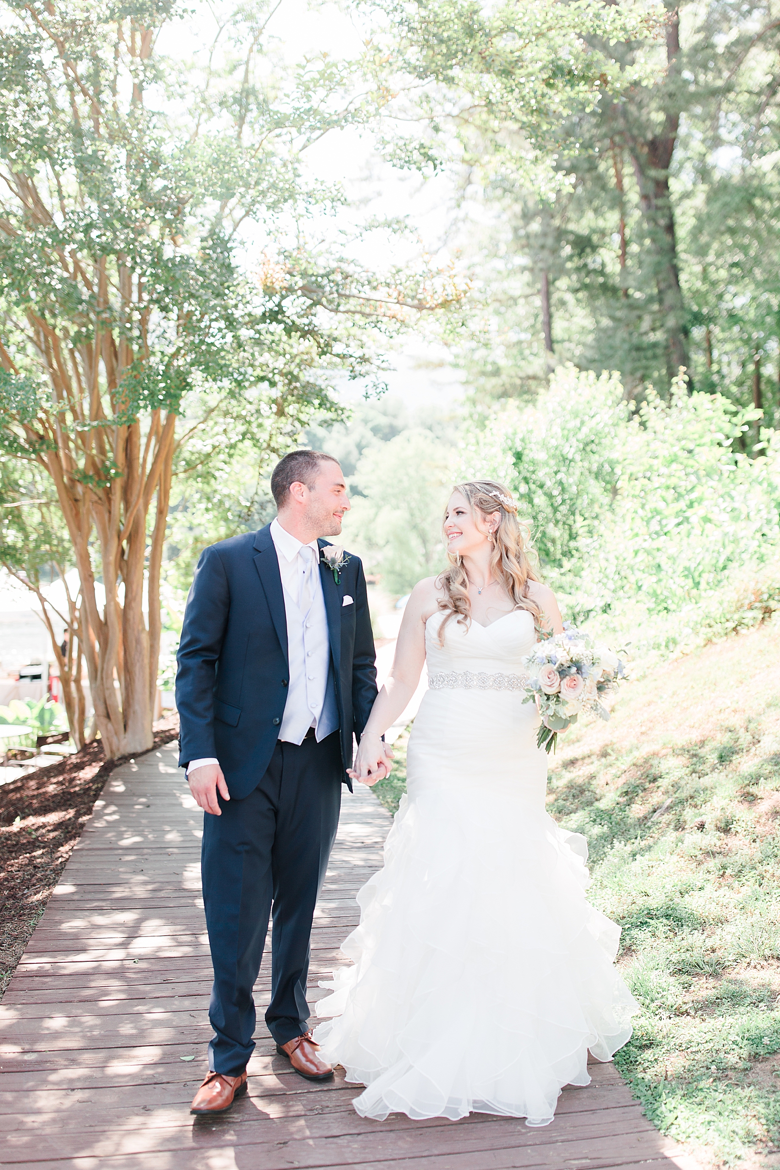 Rumbling Bald Resort Wedding Bride and Groom Walking together smiling at each other Photo