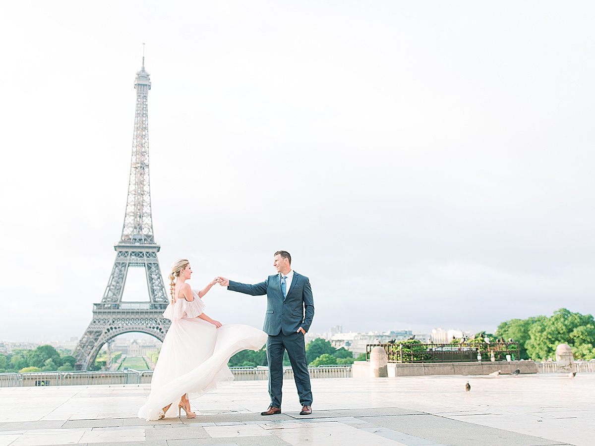Eiffel Tower Wedding Groom Twirling Bride Photo