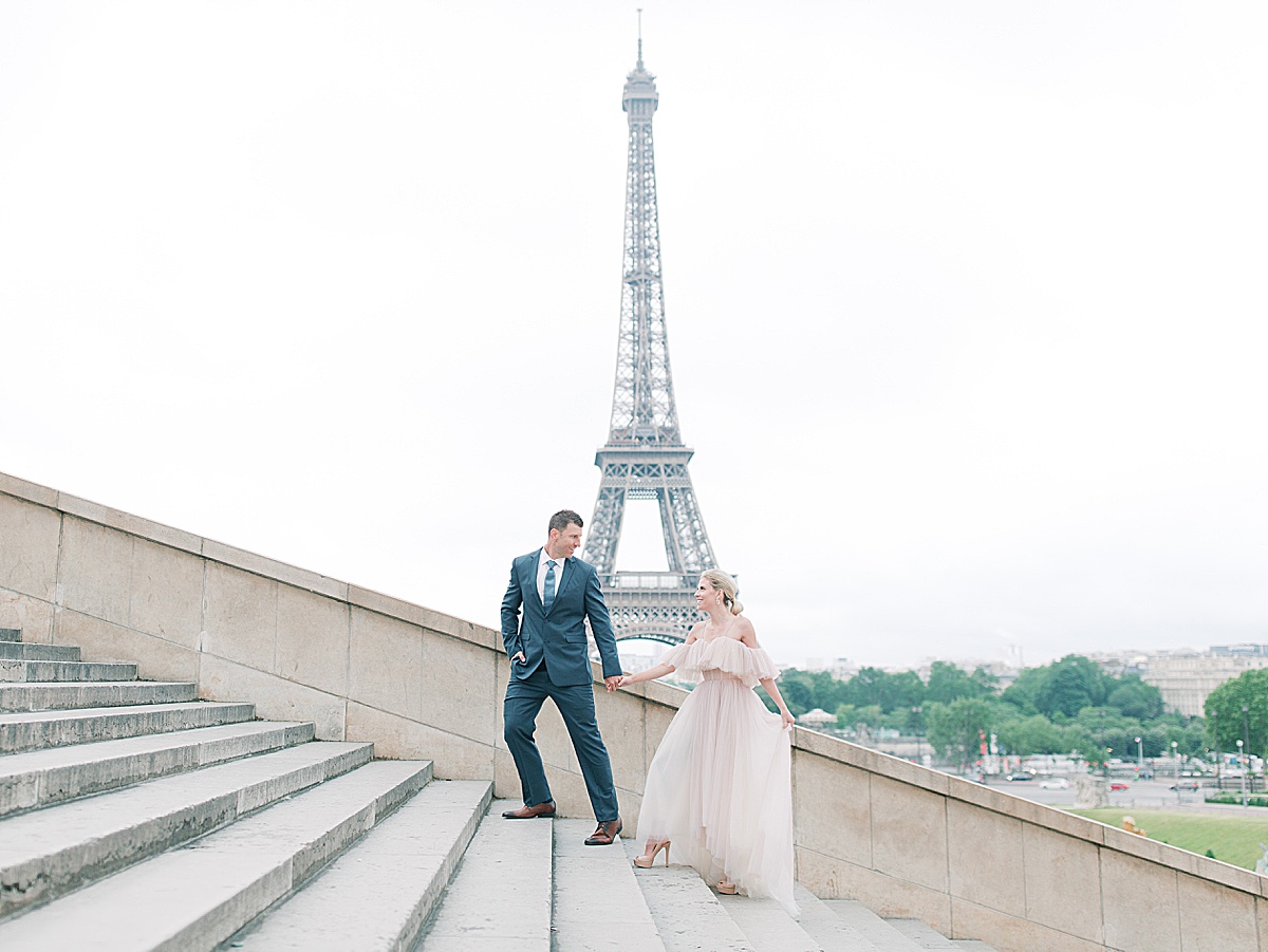 Eiffel Tower Wedding Couple Walking up Steps holding hands Photo