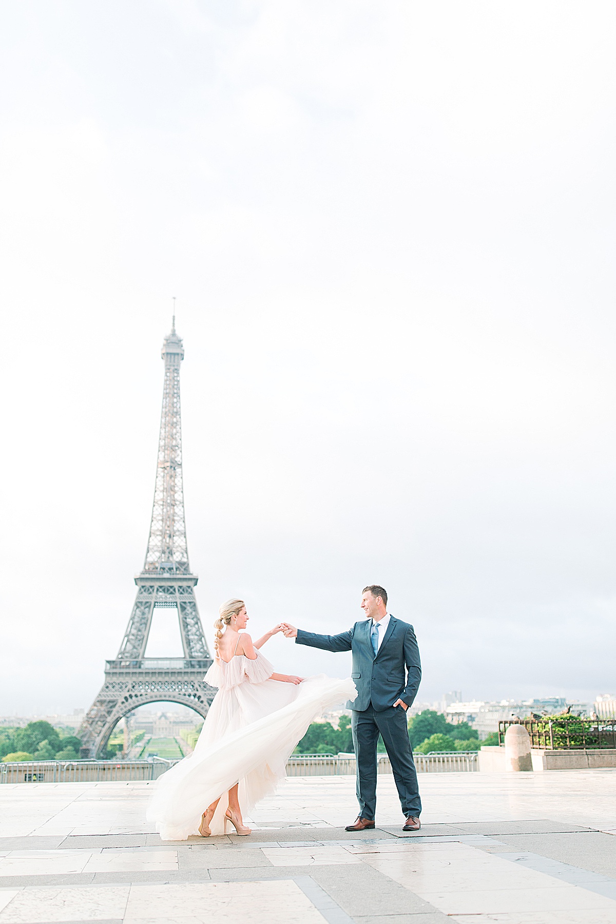 Eiffel Tower Wedding Groom Twirling Bride at the Trocadero Photo