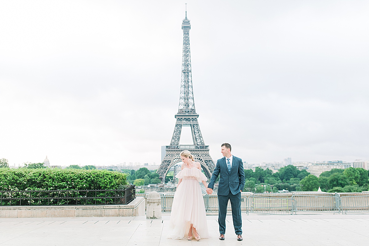 Eiffel Tower Wedding Bride and Groom Holding Hands Photo