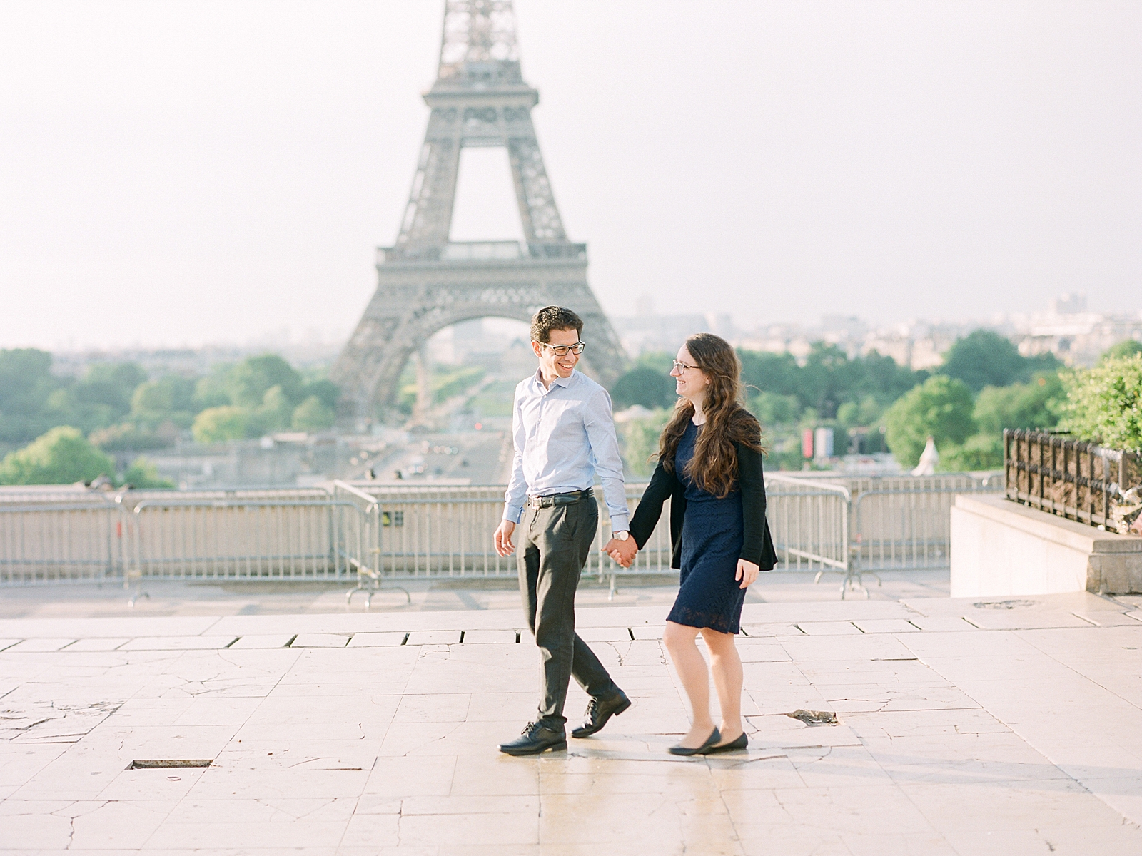 Eiffel Tower Engagement Session Couple holding hands walking Photo