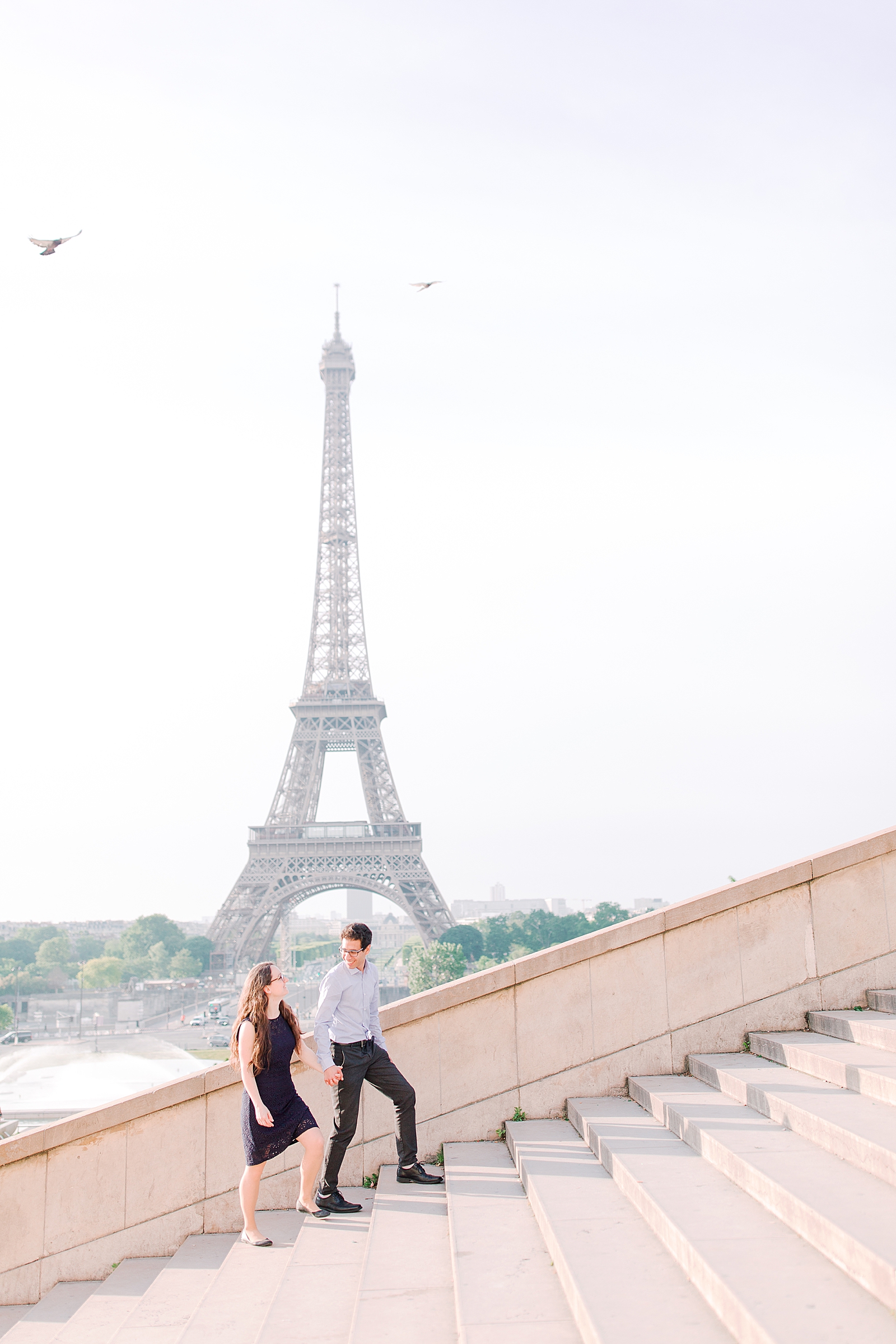 Eiffel Tower Engagement Session couple walking up stairs Photo