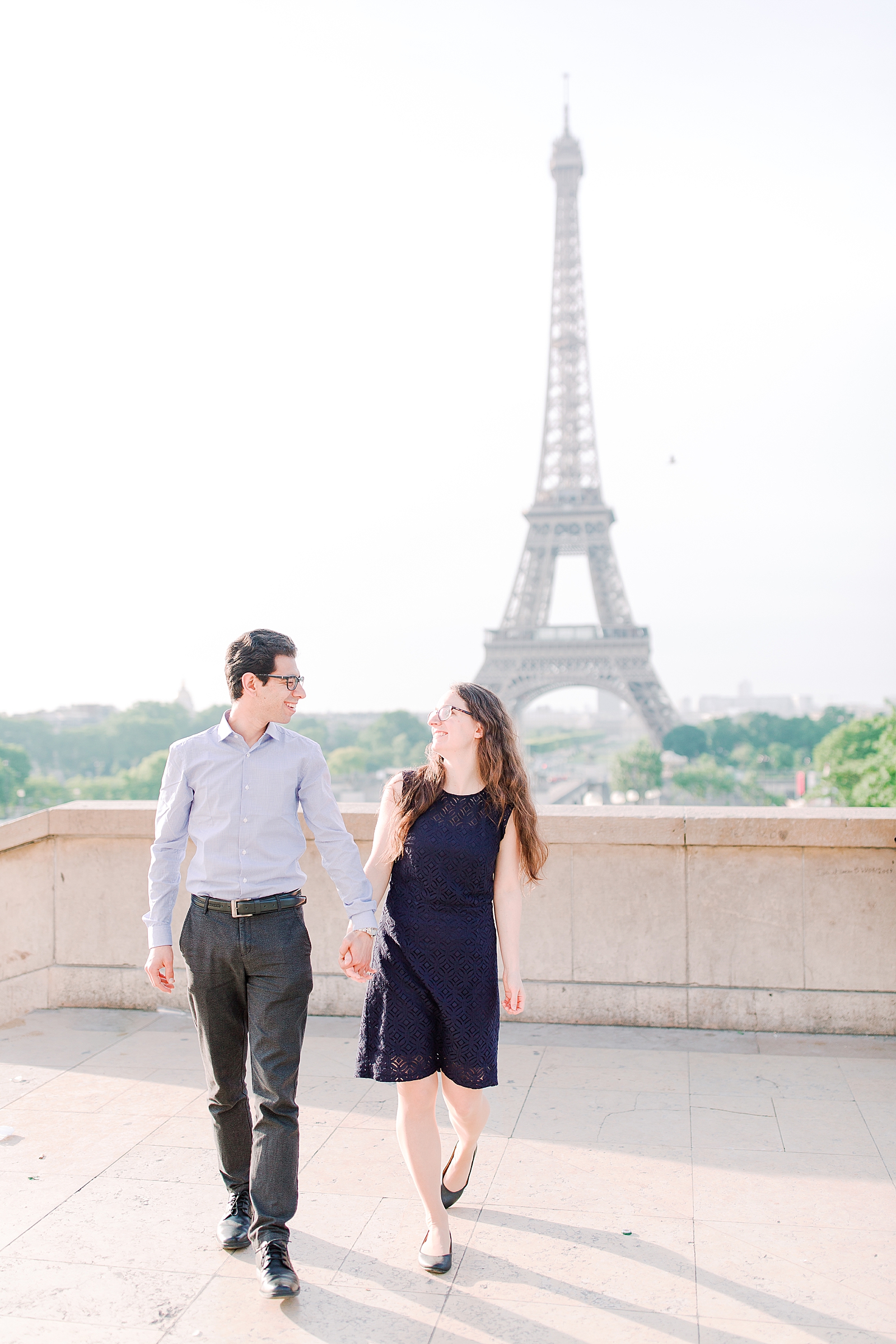 Eiffel Tower Engagement Session couple walking toward camera Photo