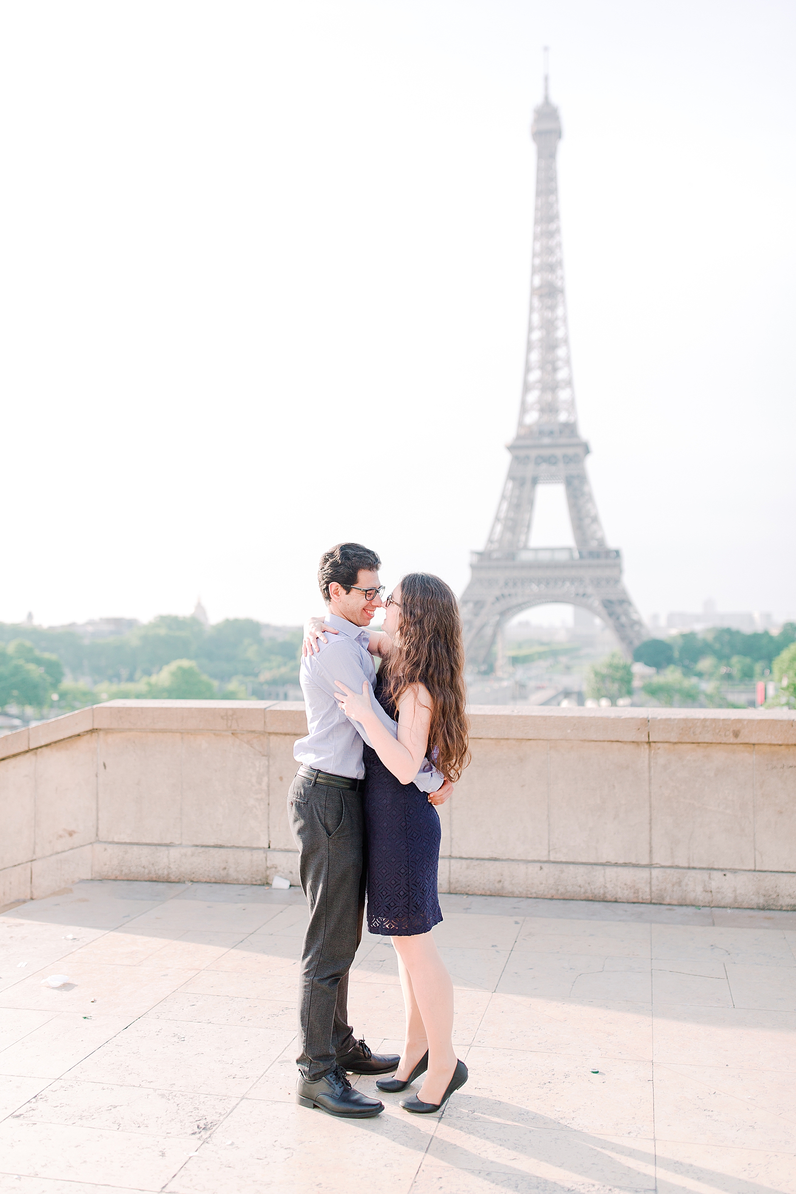 Eiffel Tower Engagement Session Couple hugging Photo