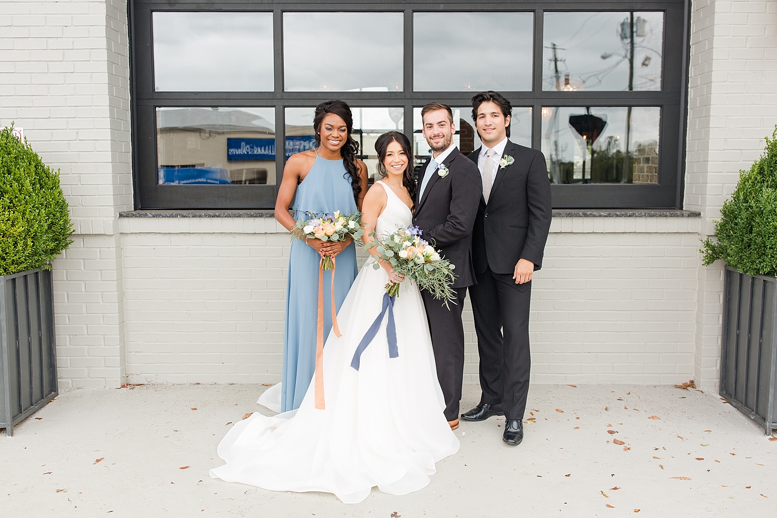 Glover Park Brewery Wedding Bridal Party smiling at camera in front of venue Photo