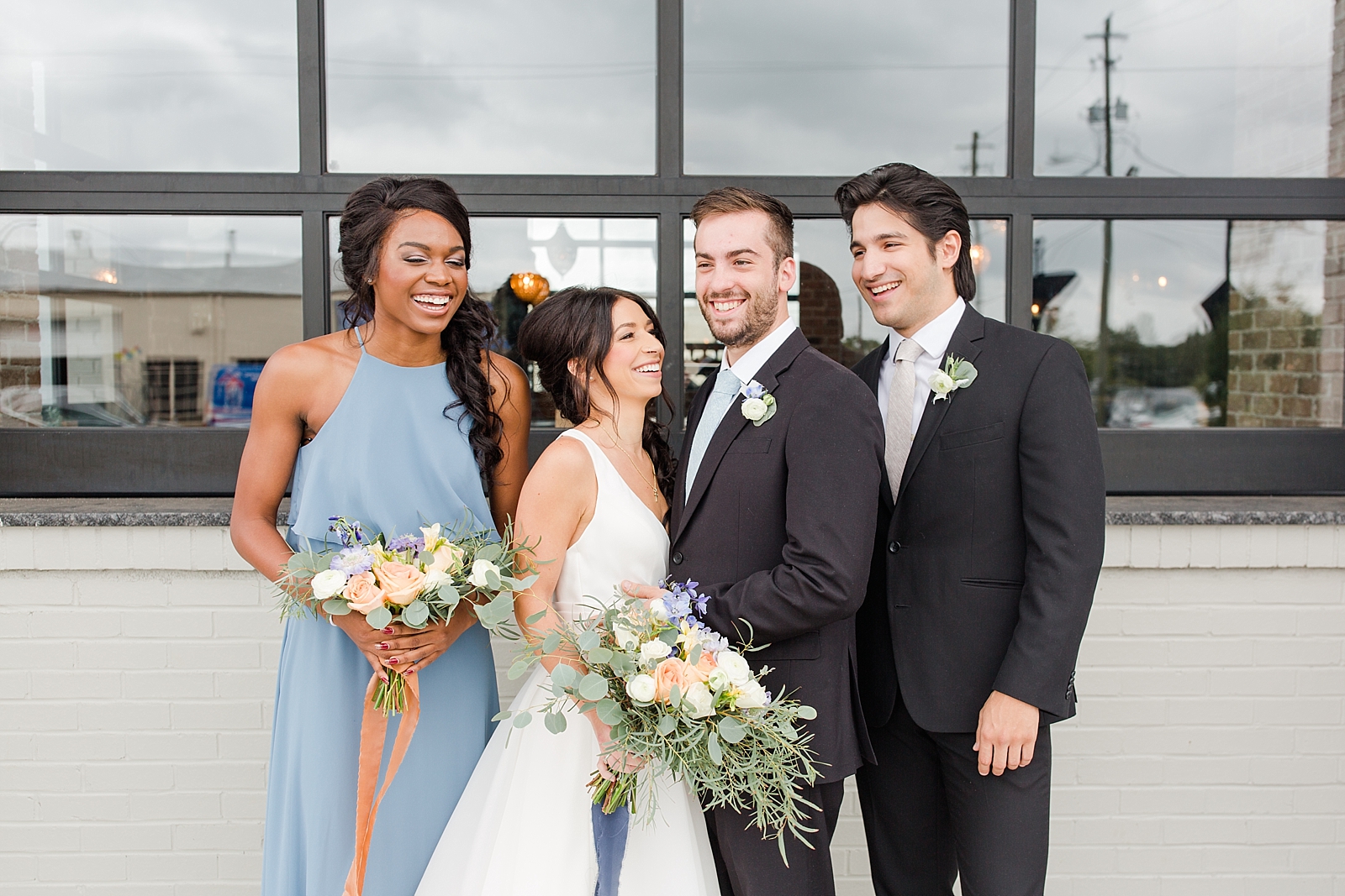 Glover Park Brewery Wedding Bridal Party laughing together in front of venue Photo