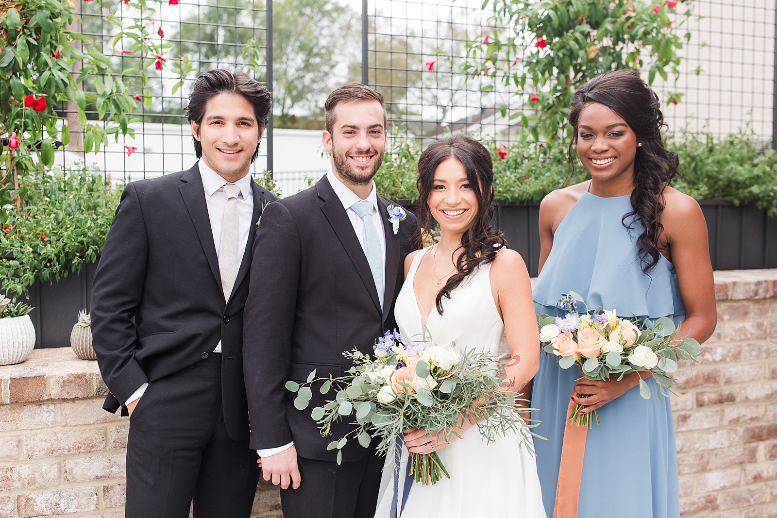 Glover Park Brewery Wedding Bridal Party smiling at camera in front of trellis Photo