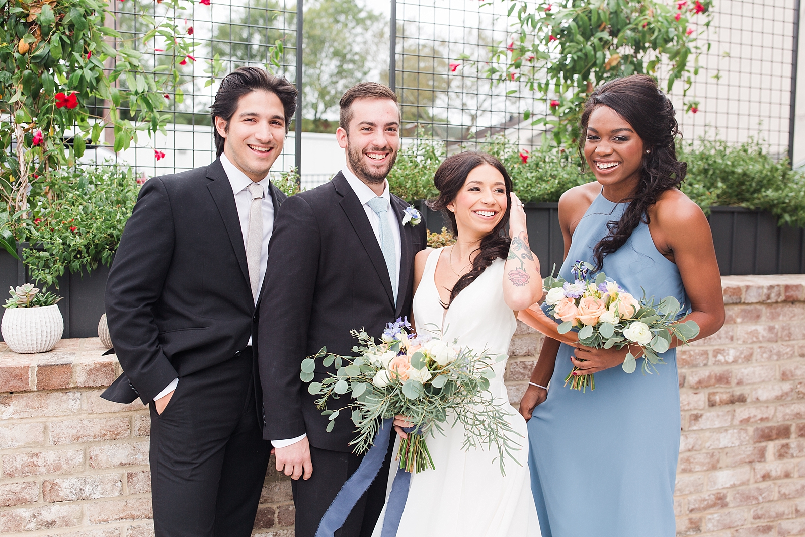 Glover Park Brewery Wedding Bridal party laughing in front of trellis Photo