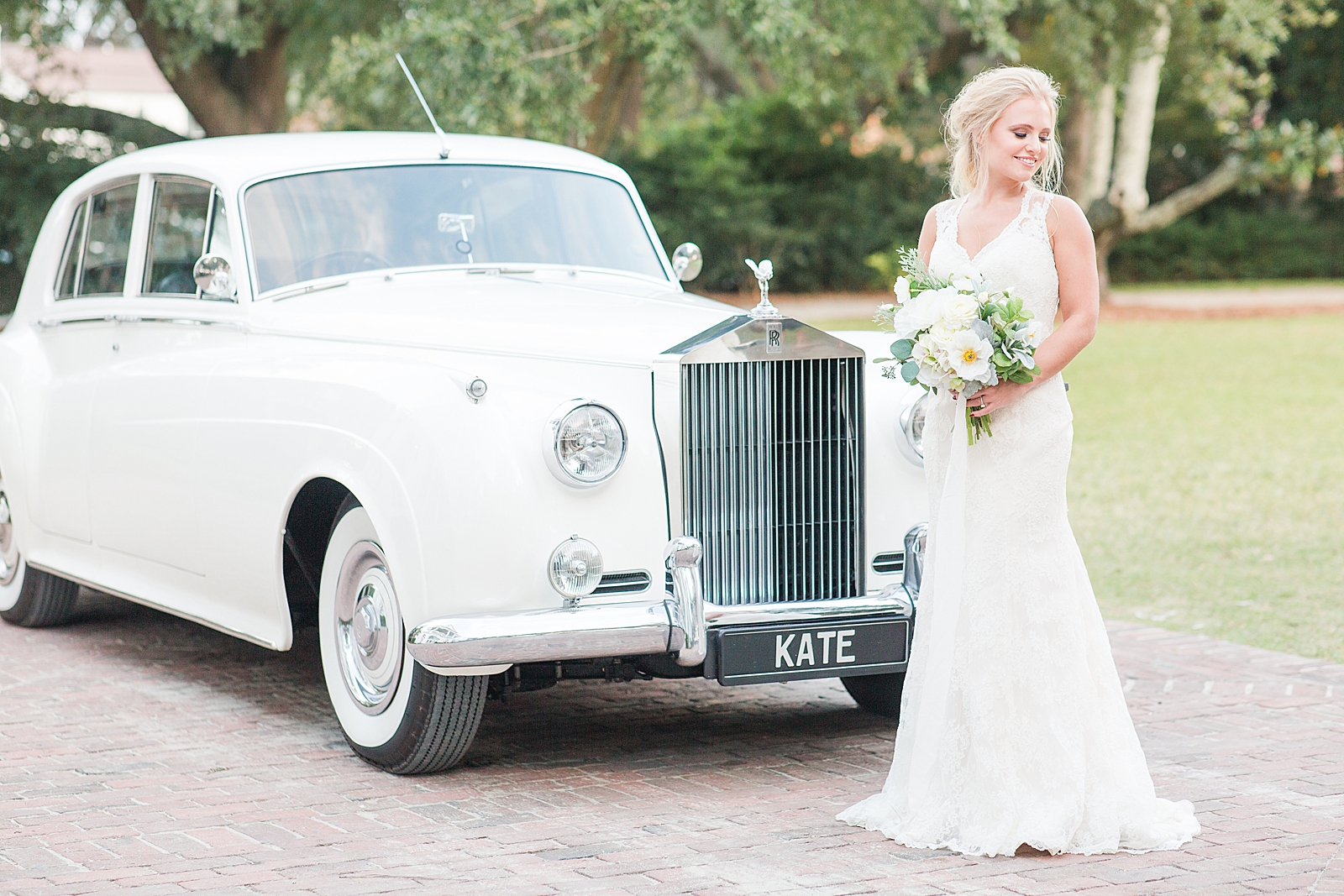 Charleston Photography Bridal Session Bride smiling over her shoulder in front of 1959 Rolls-Royce Photo