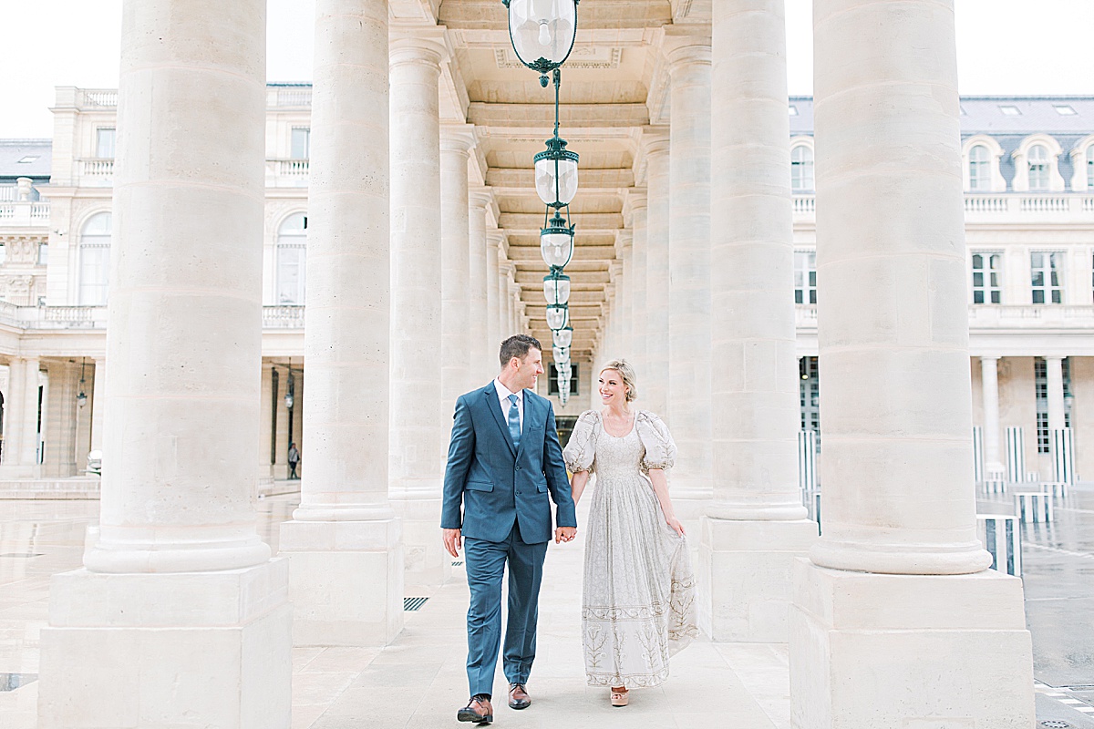 Palais Royal Engagement Couple Walking Toward Camera in Columns Photo