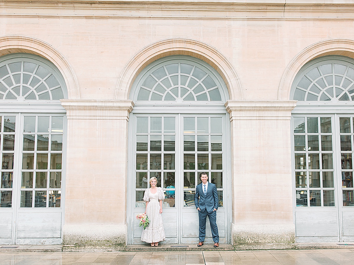 Palais Royal Engagement Couple standing under archway Photo