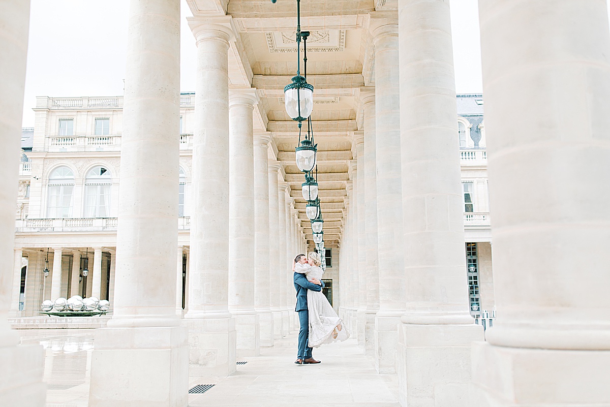 Palais Royal Engagement Couple Spinning in between columns Photo