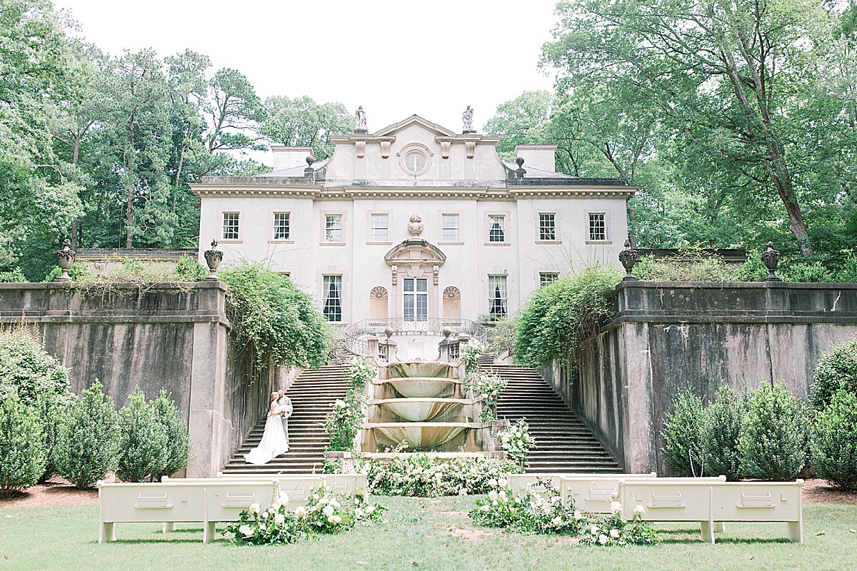 Swan House Wedding Couple Kissing on Stairs Photo