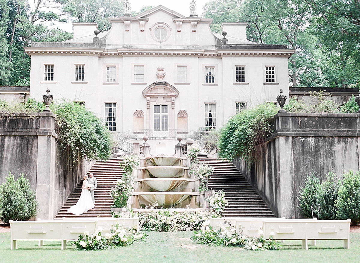 Swan House Wedding Couple on Stairs by Water Fountain Photo
