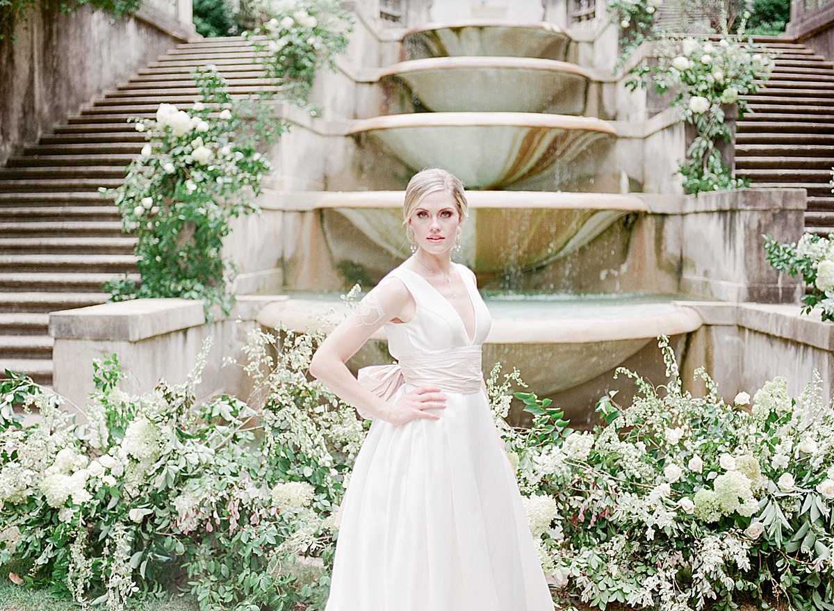 Swan House Wedding Bride Looking at Camera in Front of Fountain Photo