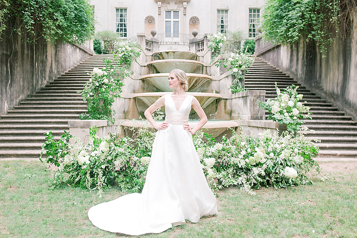 Swan House Wedding Bride hands on hips in front of Fountain Photo