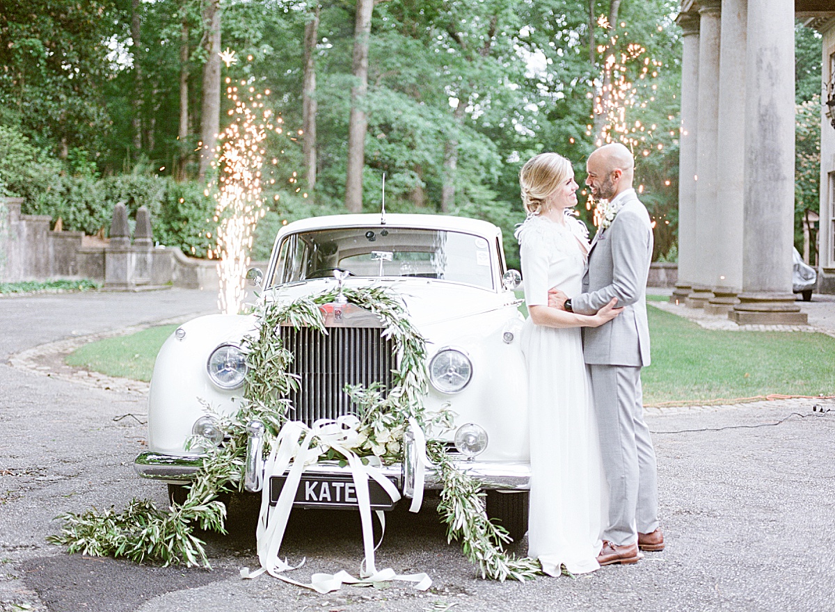 Swan House Wedding Bride and Groom With Vintage Car and Sparklers Photo