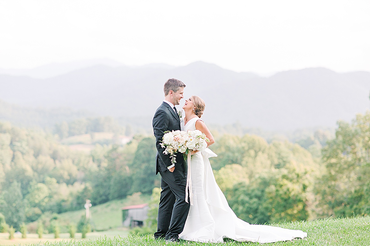 The Ridge Asheville Wedding Venue Couple laughing with mountains in background Photo
