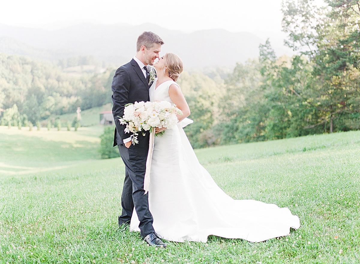Couple Hugging Nose to Nose at Asheville Wedding Venue The Ridge Photo