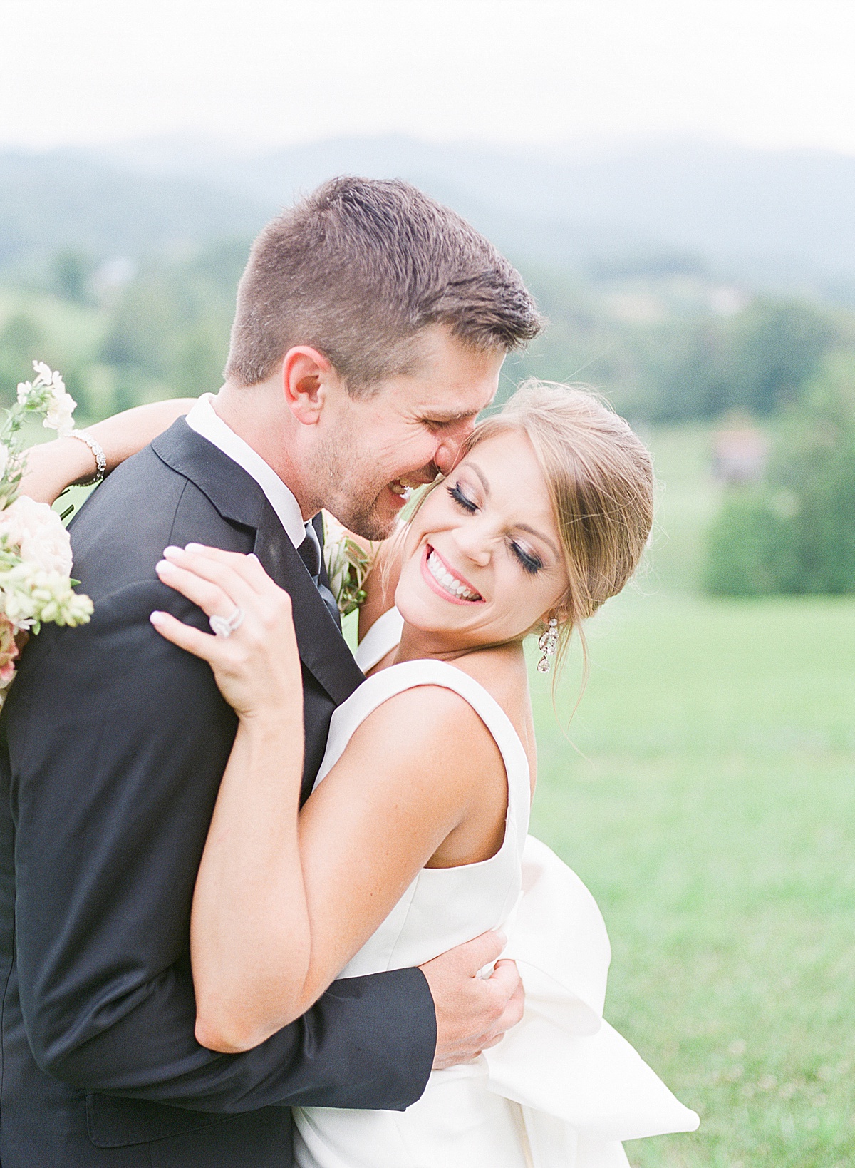 The Ridge Asheville Wedding Bride and Groom Laughing and Hugging Photo