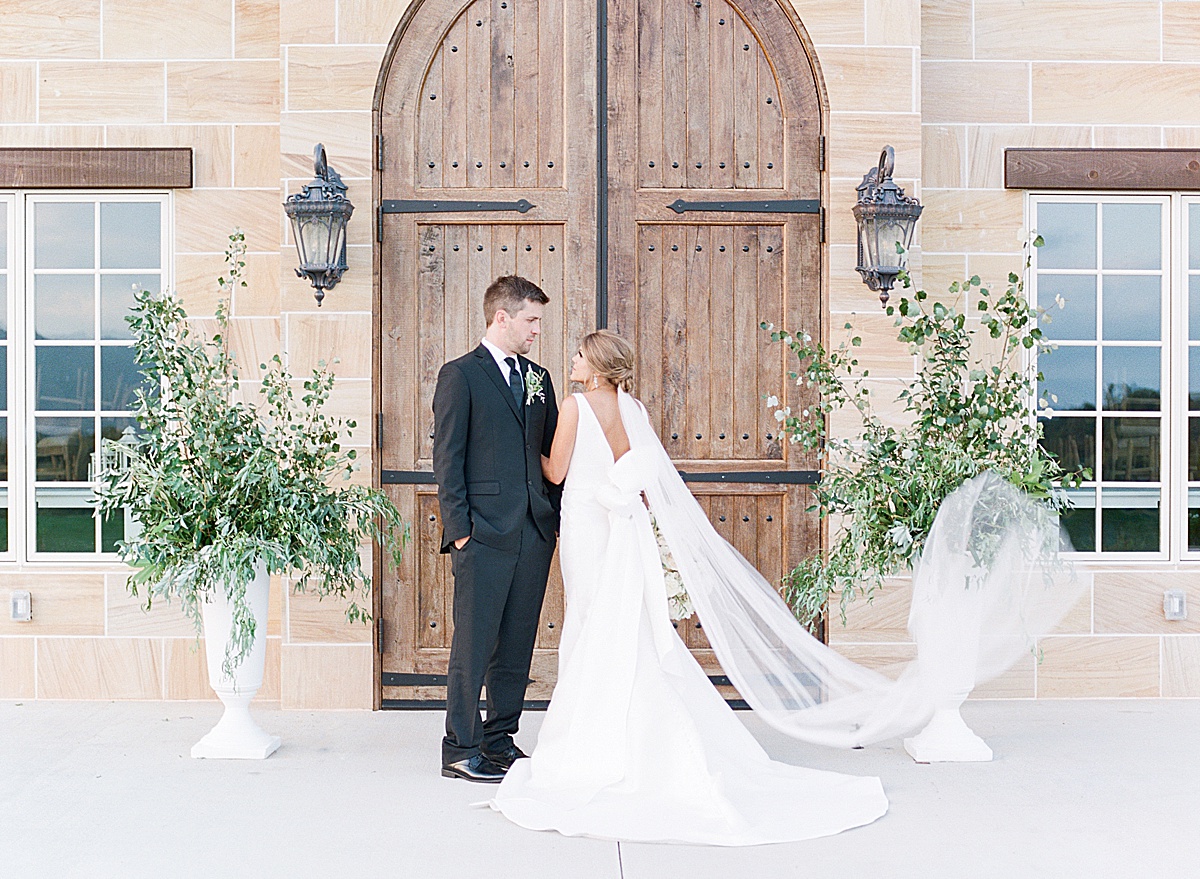 The Ridge Asheville Wedding Bride and Groom in front of wood chateau doors Photo