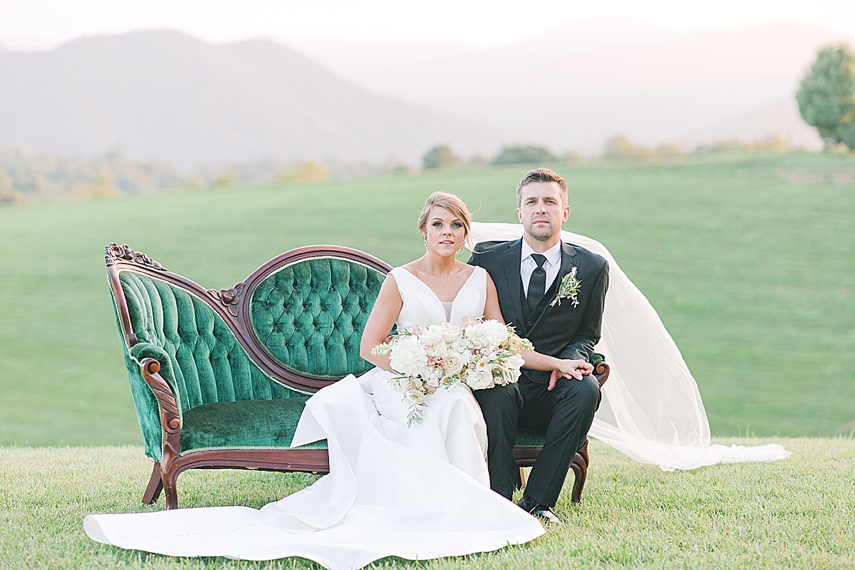 The Ridge Asheville Wedding Bride and Groom sitting on couch Photo