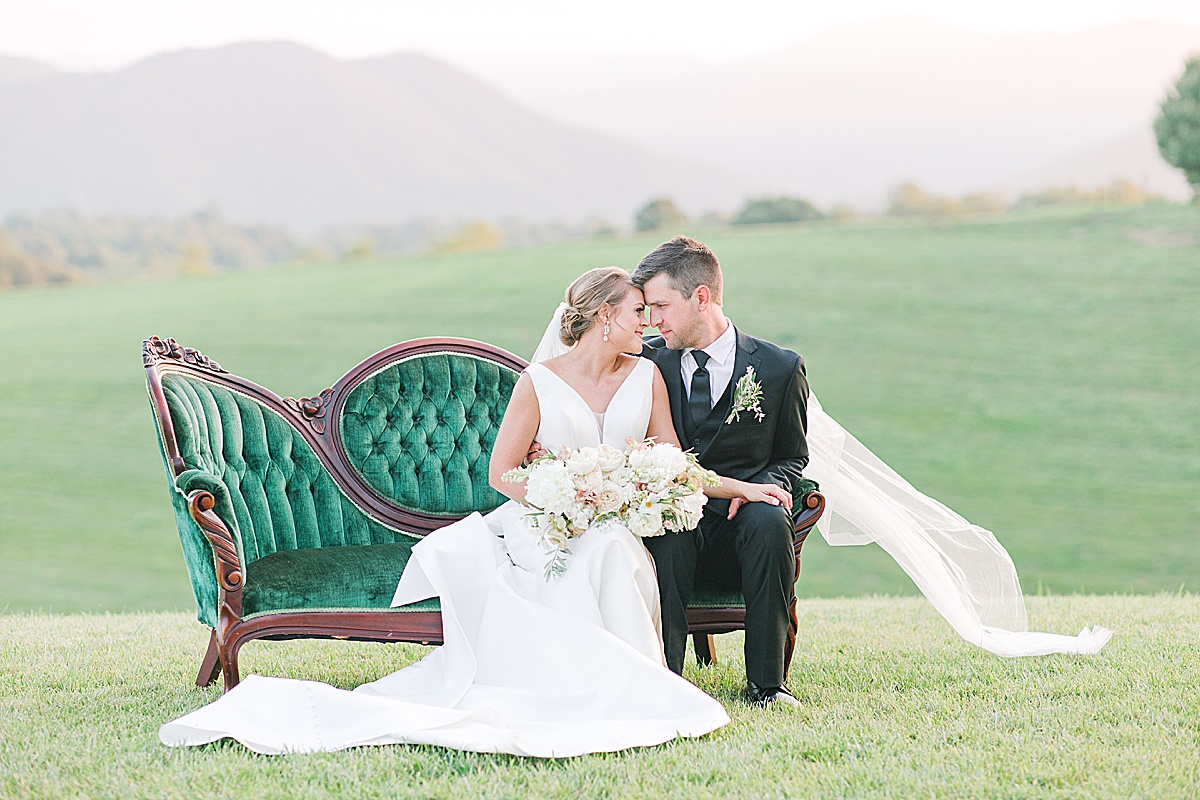 The Ridge Asheville Wedding Venue Couple sitting on couch nose to nose Photo