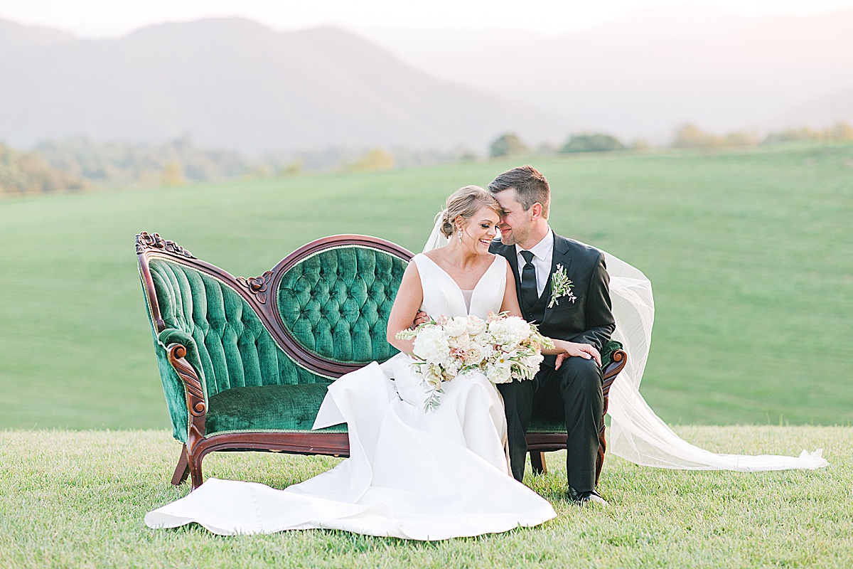 The Ridge Asheville Wedding Couple snuggling on Green Couch Photo