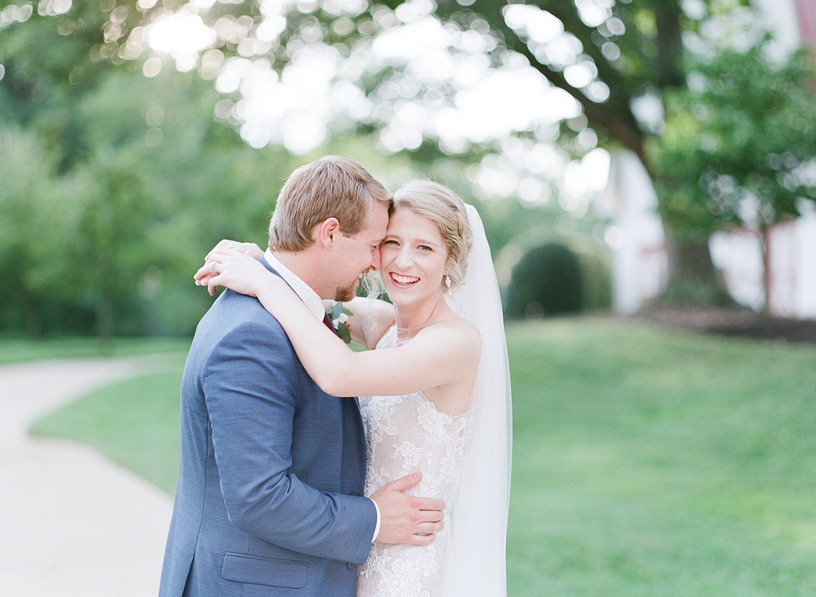 7 Reasons Why We Still Shoot Film Bride and Groom Snuggling Photo