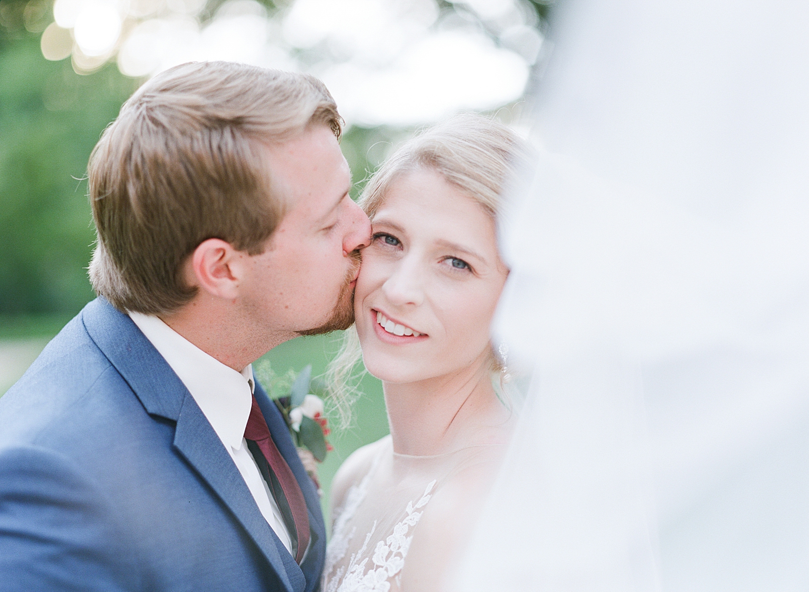 Winmock Wedding Groom kissing Bride Photo