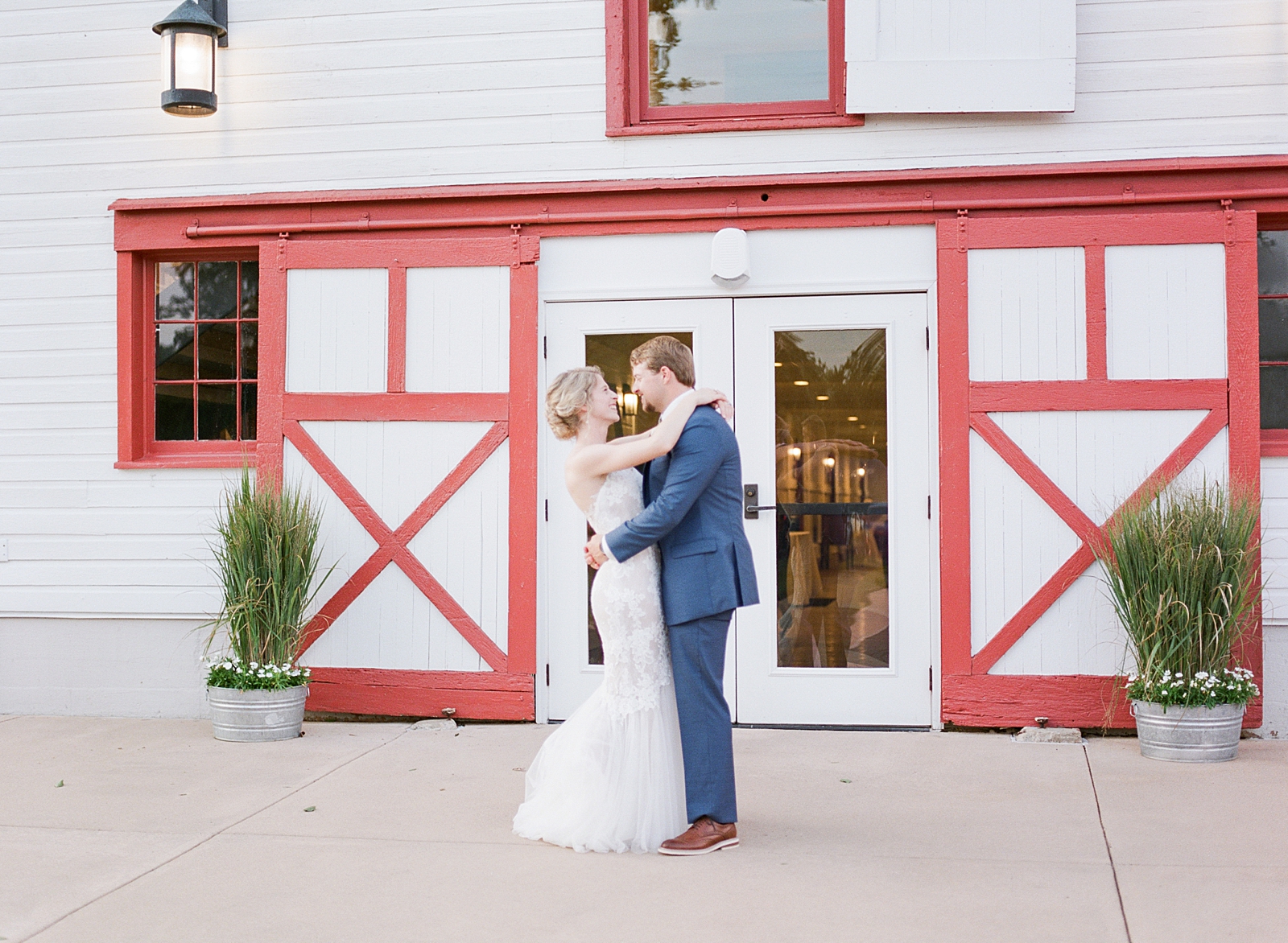 Winmock Wedding Bride and Groom Hugging in Front of Venue Photo