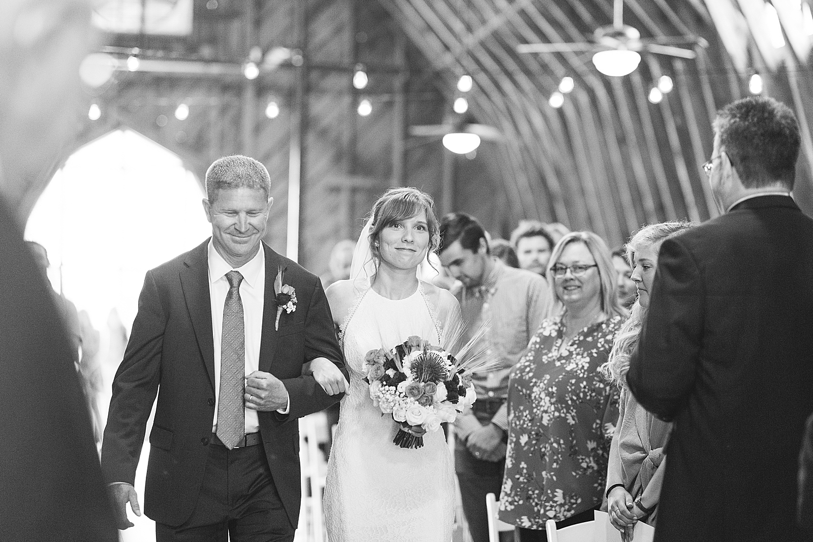 Dairy Barn Wedding Black and White of Bride walking down aisle with her dad Photo