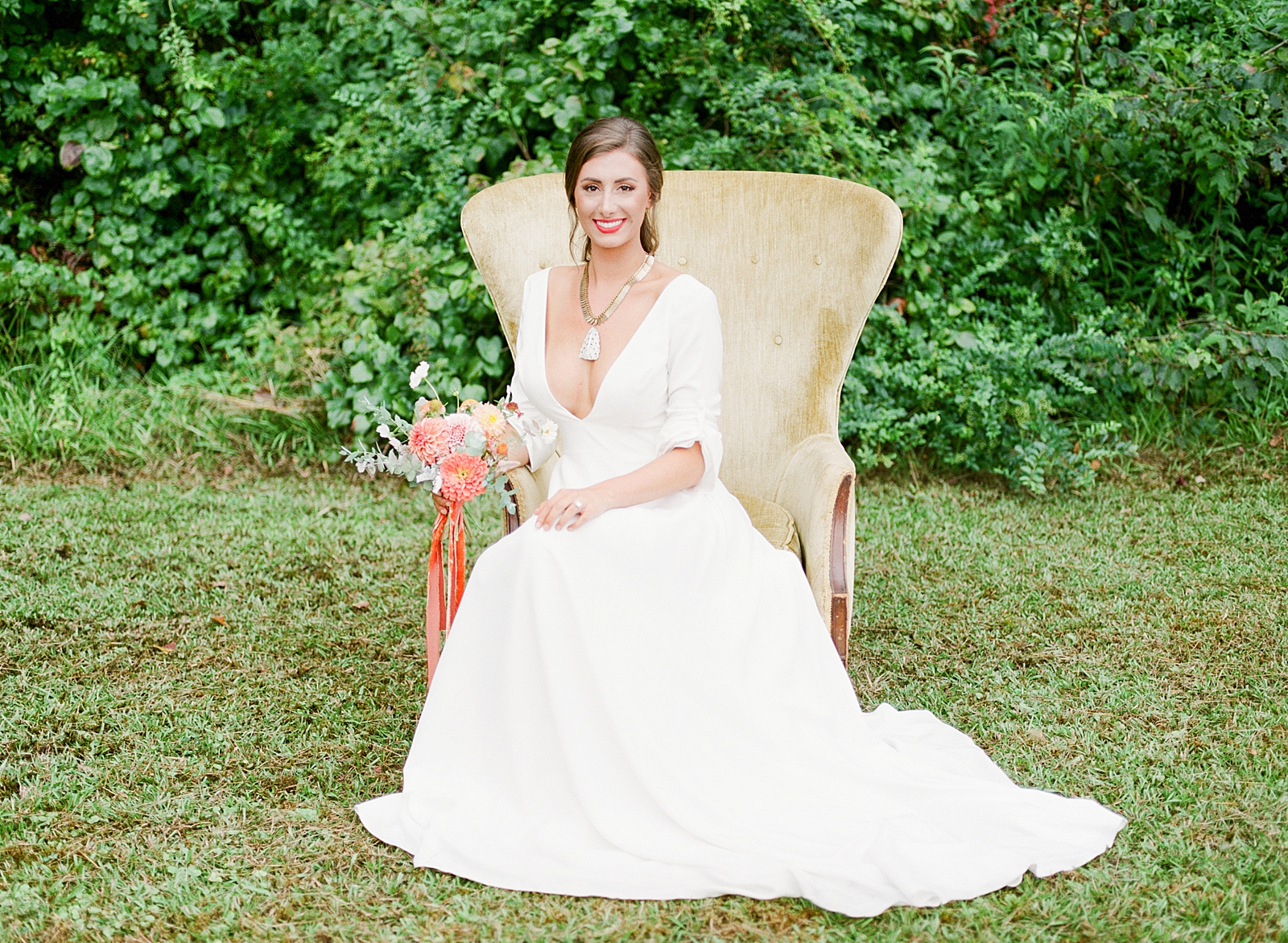 Birmingham Wedding Bride sitting in Yellow Chair smiling at Camera Photo