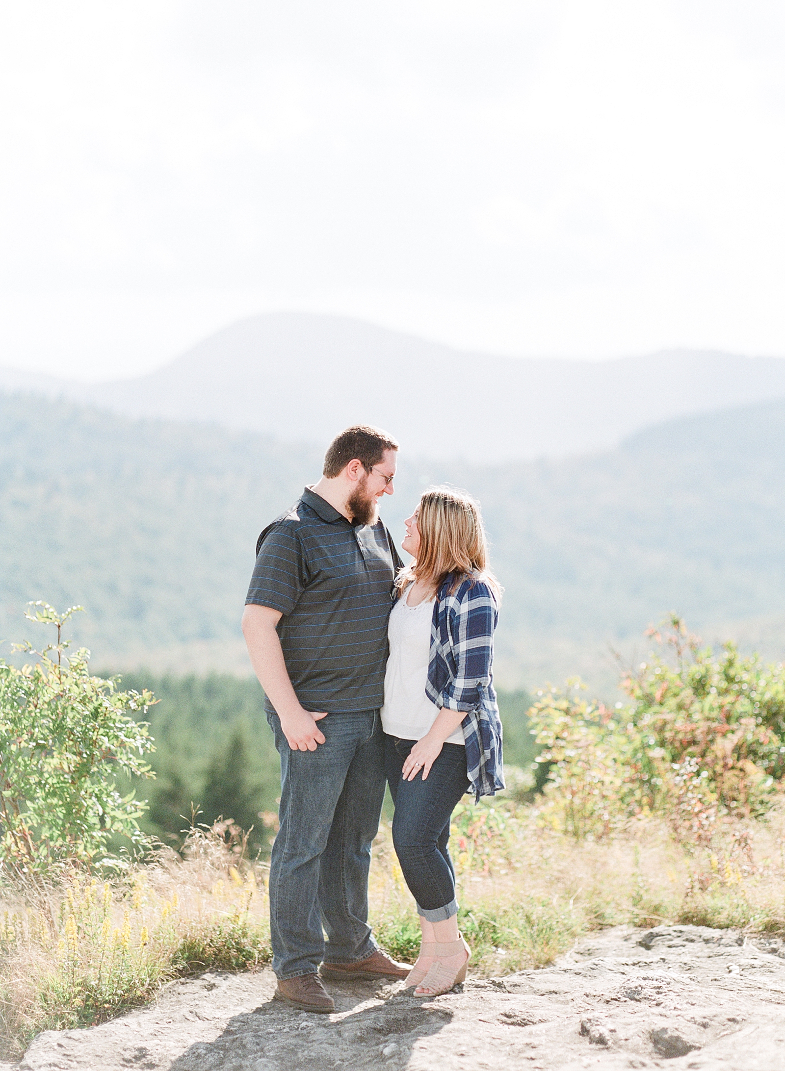 Blue Ridge Parkway Engagement Couple Smiling and hugging Photo