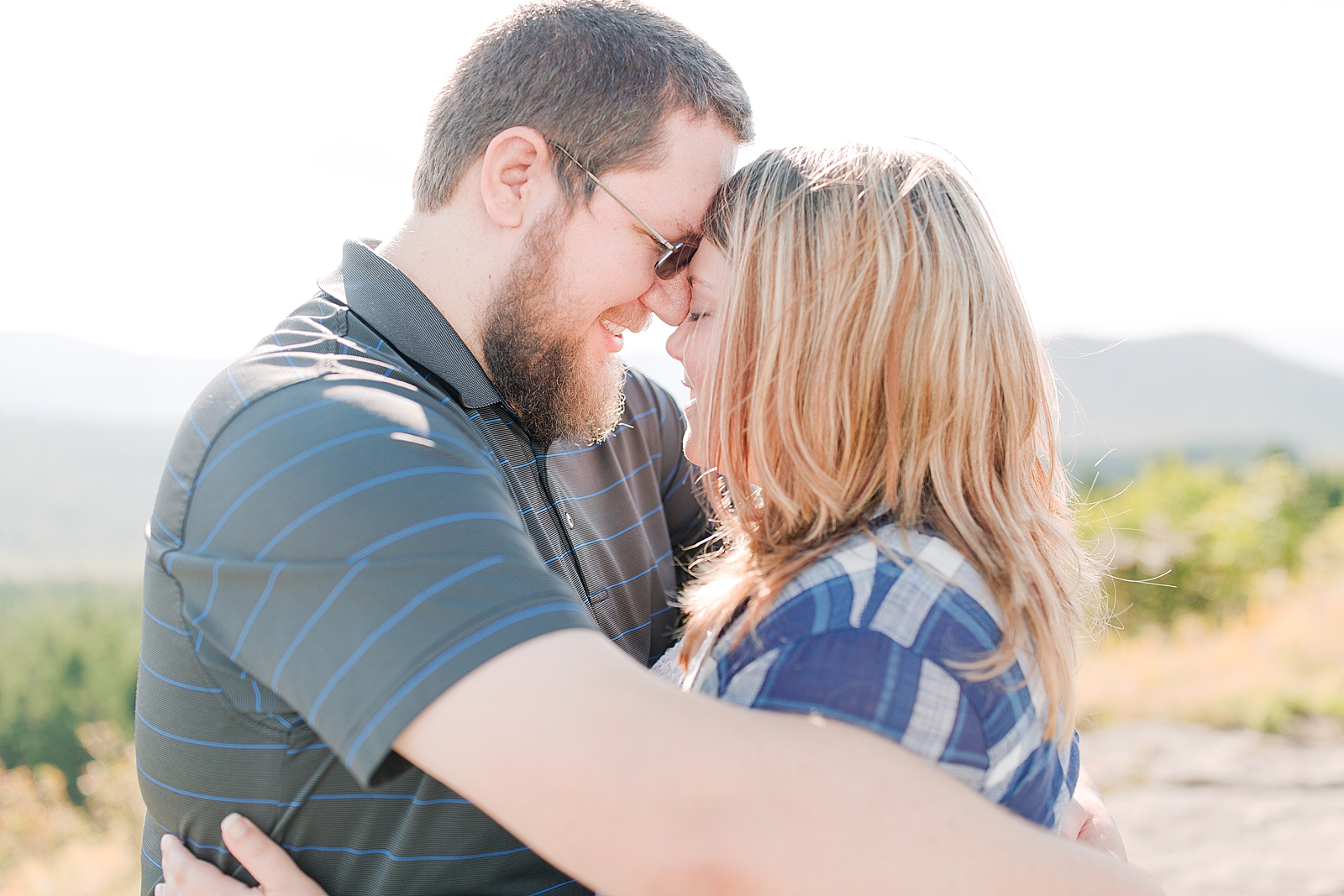 Blue Ridge Parkway Engagement Couple Hugging Nose to Nose Photo