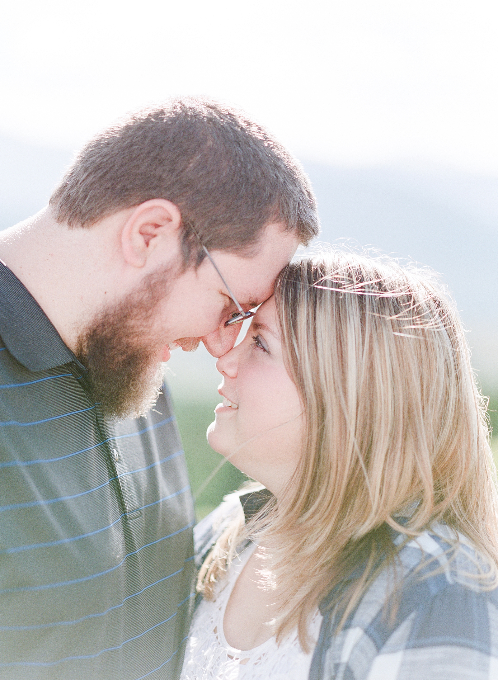 Blue Ridge Parkway Engagement Couple looking at each other nose to nose Photo