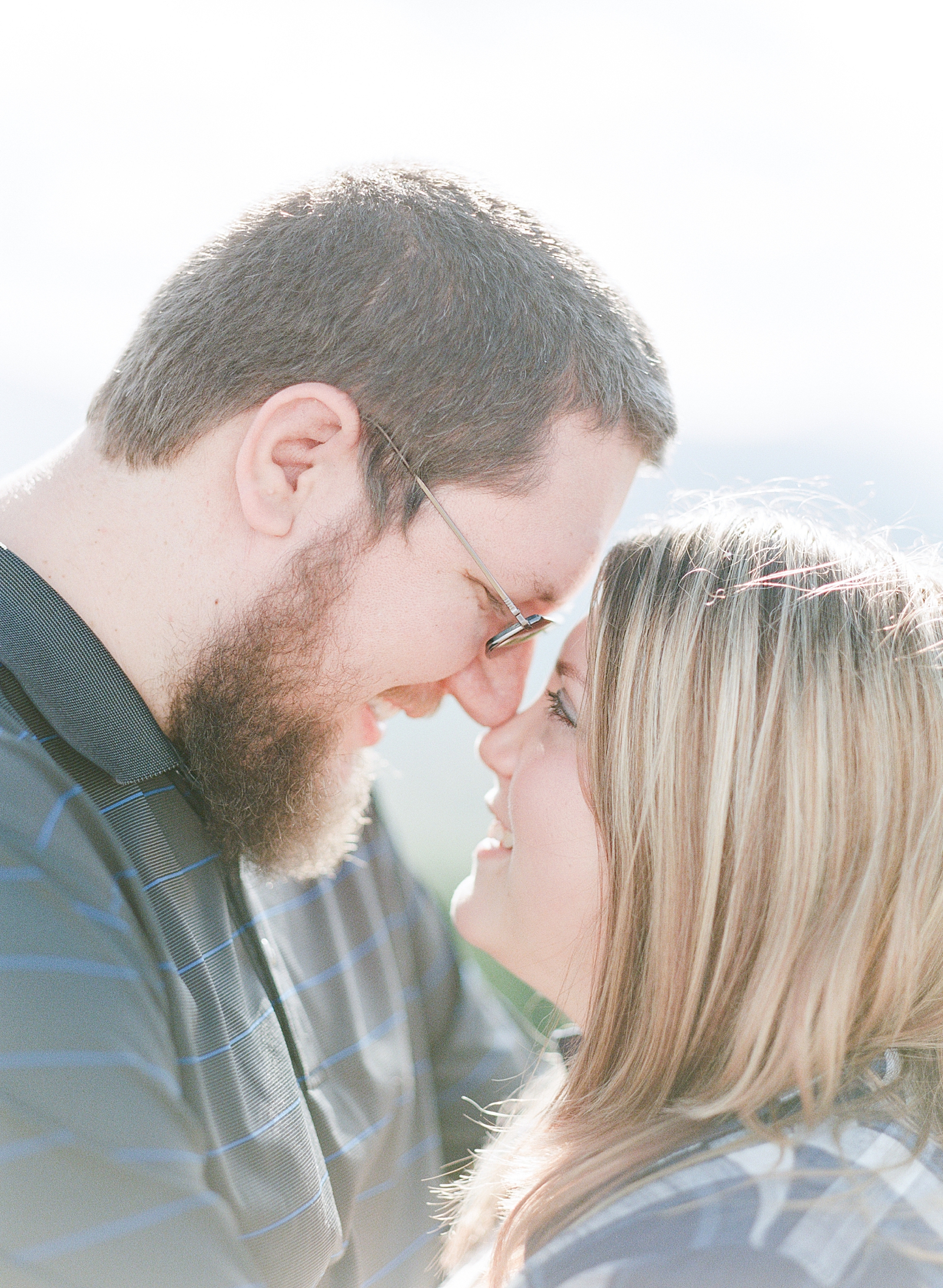 Blue Ridge Parkway Engagement Couple Smiling nose to nose Photo