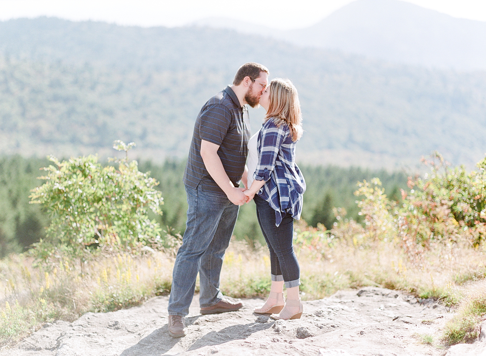 Blue Ridge Parkway Engagement Couple Kissing Holding Hands Photo